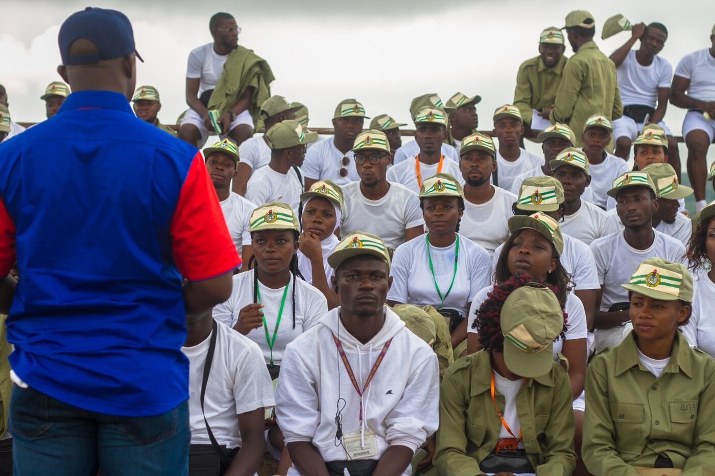 Facilitator speaking to a large group of corps members